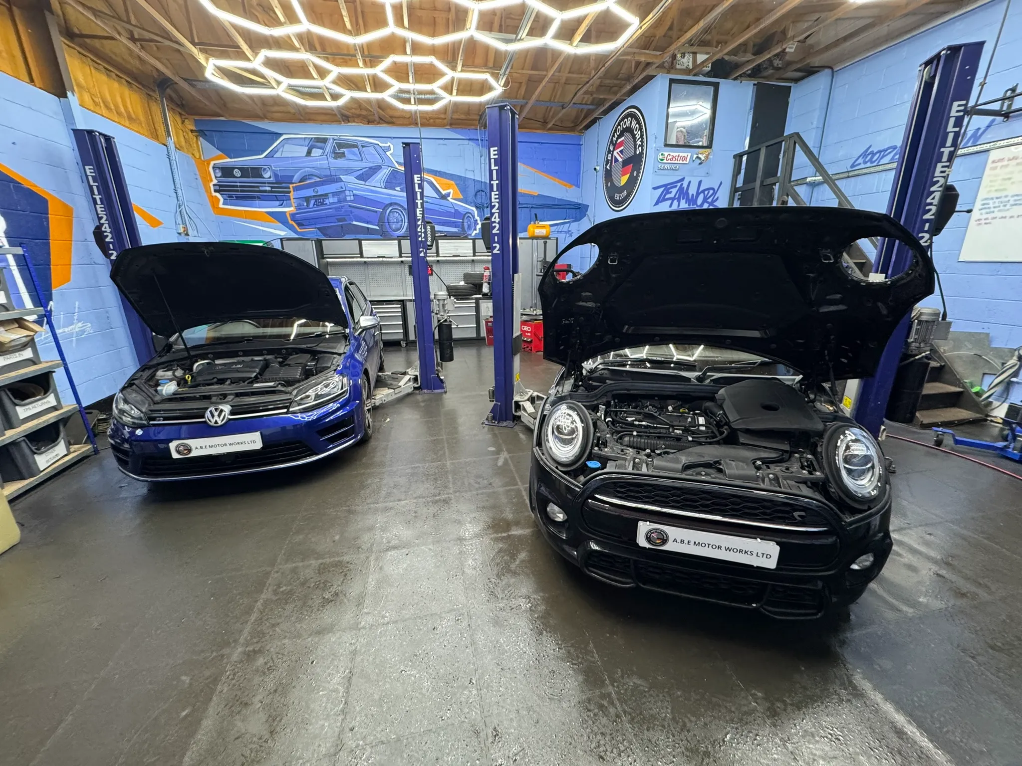 mini and vw with bonnet up