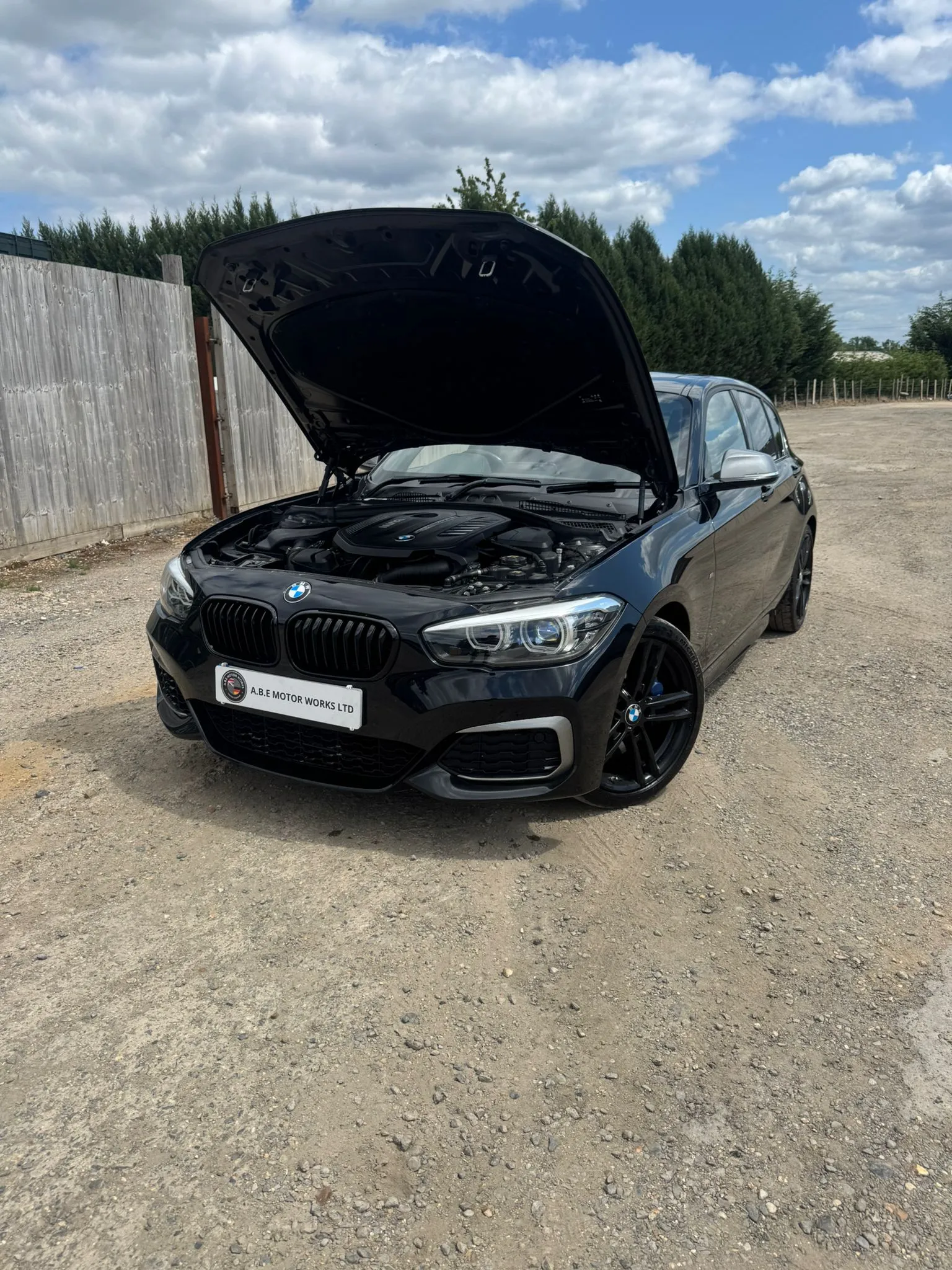bklack car with hood up